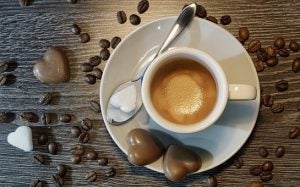 cup of coffee and chocolate hearts around 