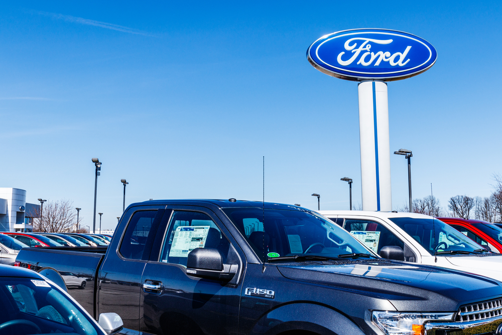 A view of truck inventory of a Ford Dealership parking lot near Waco, TX
