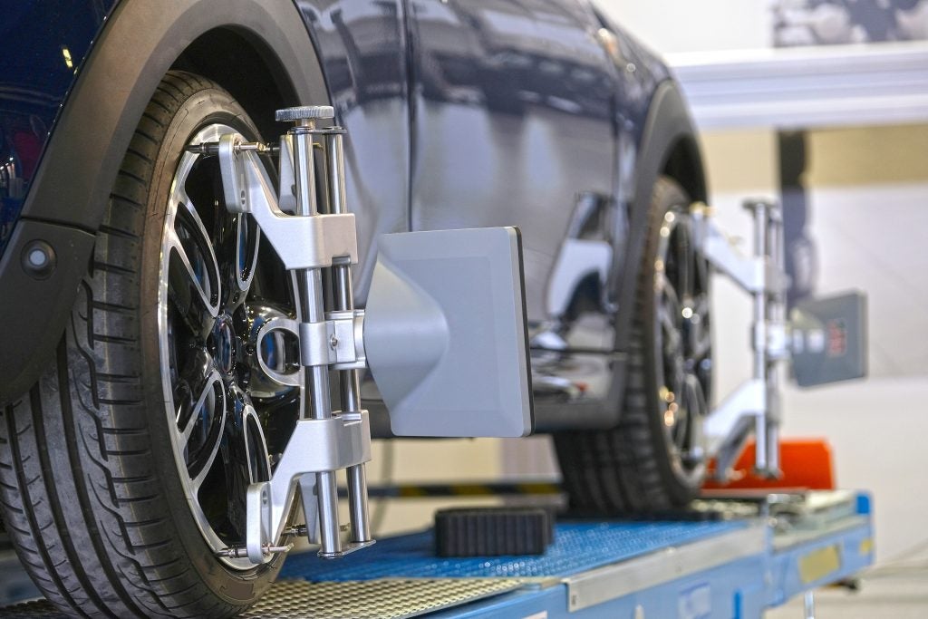 Image of a vehicle getting a wheel alignment done