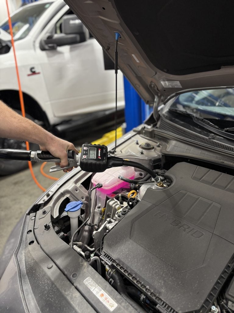 Image of an oil pump filling an engine with new engine oil