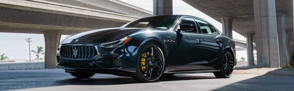 Maserati Ghibli riding in a city, showing its luxury comfort.