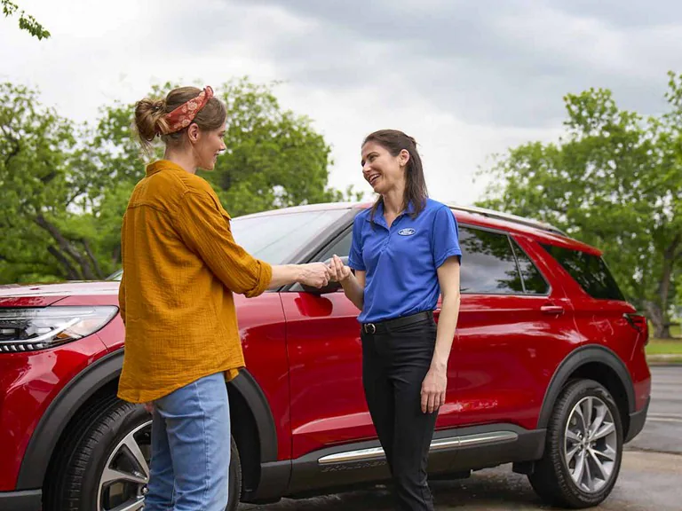 A Ford employee is providing customer service