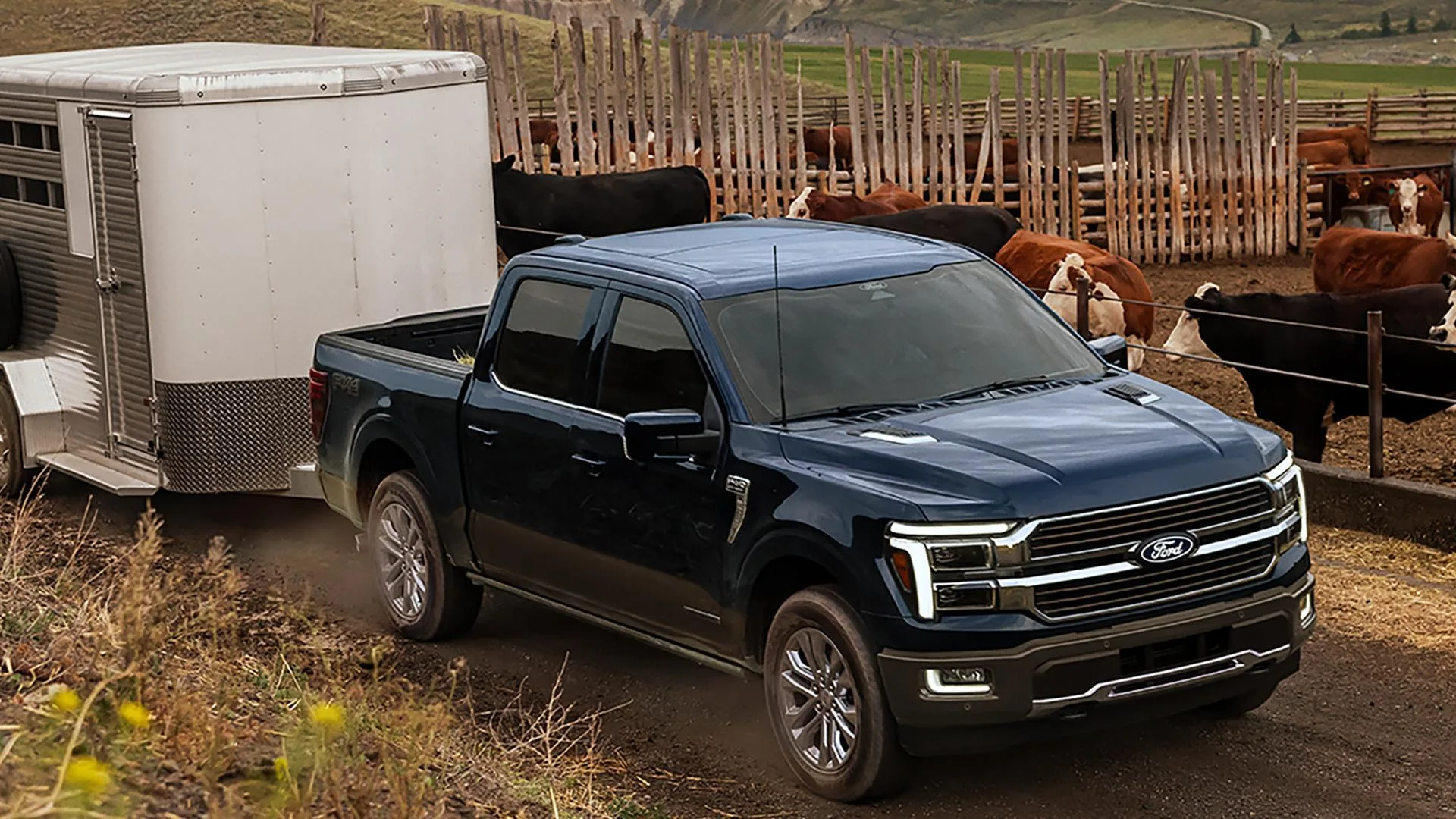 Ford F-150 King Ranch towing a trailer on a ranch