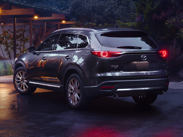 A Mazda CX-9 driving at night