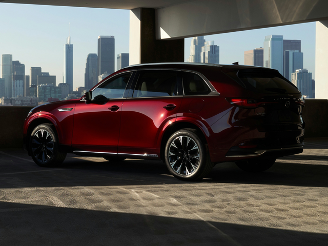 A red Mazda parked in a garage