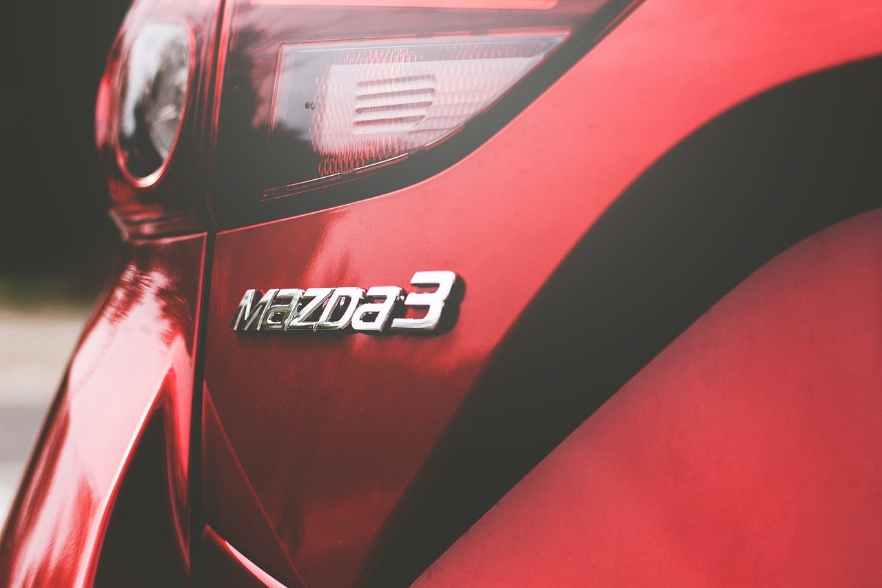 The rear headlight of a red Mazda3 vehicle