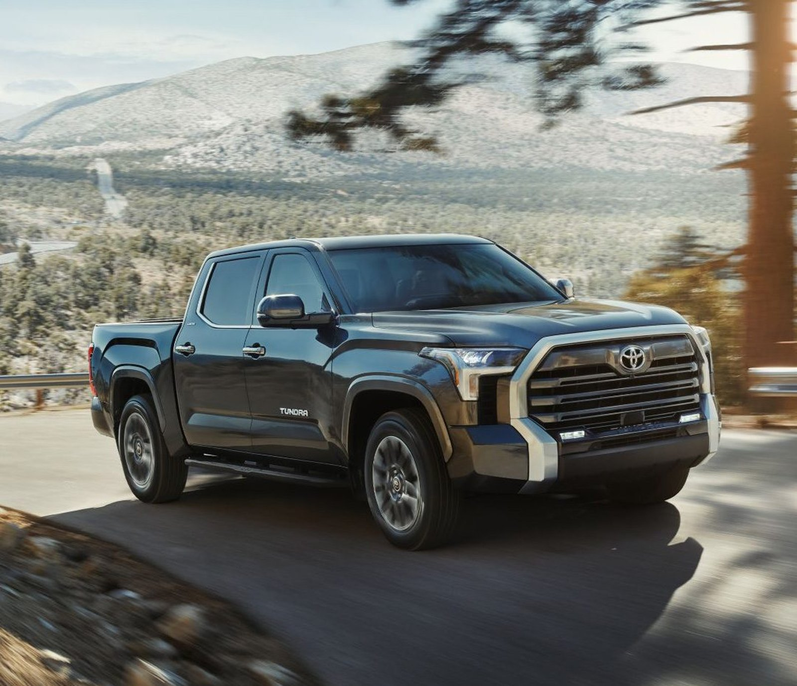 A Toyota Tundra TRD Pro truck drives through a shallow rocky area.