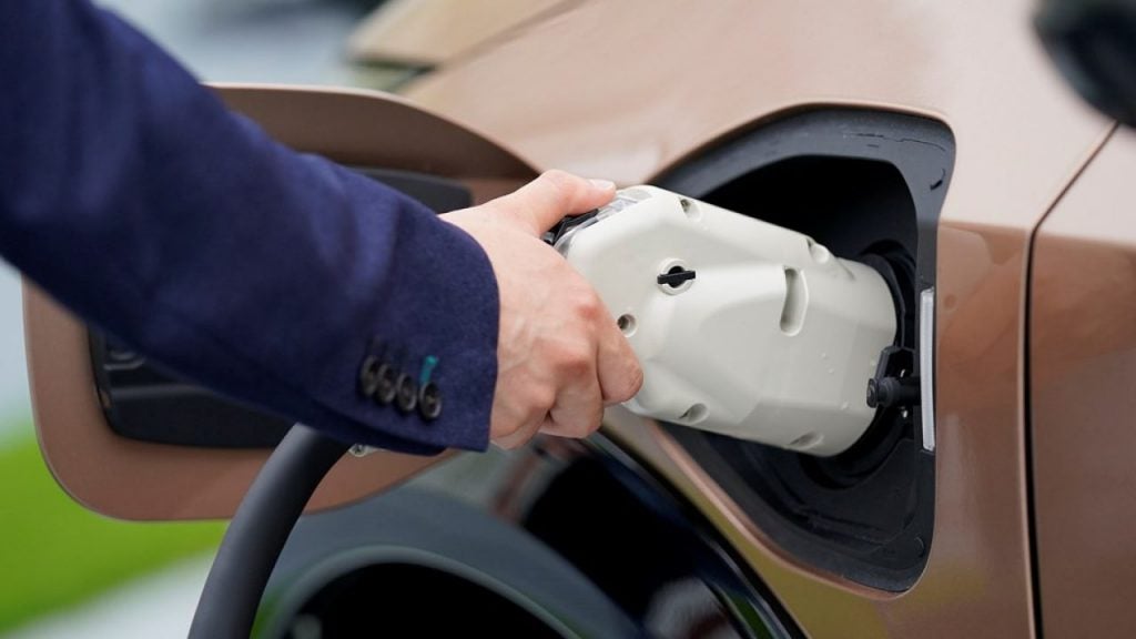 A Stuart Florida driver plugs in charger port into 2022 Nissan Ariya