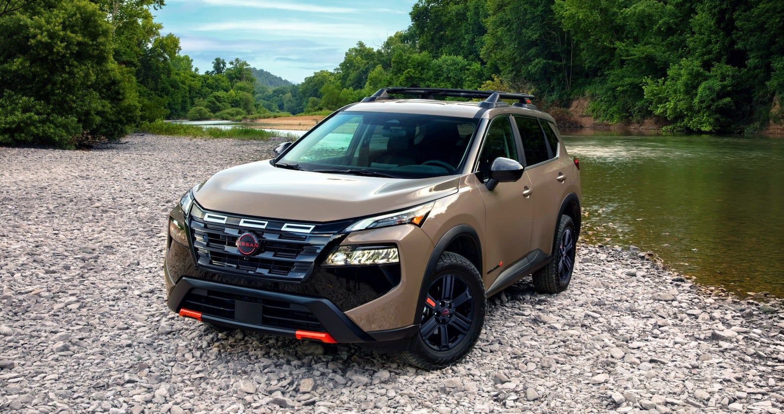 Tan 2025 Nissan Rogue near water