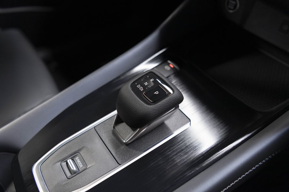 Center console shows driver mode settings in the 2023 Nissan Rogue Sport.