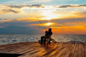 Person Fishing on Dock 