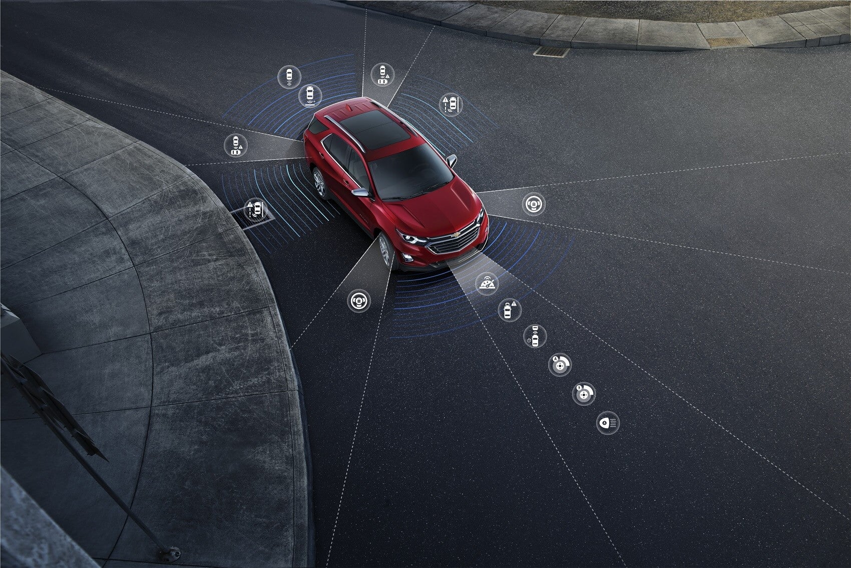 An infographic displays the placement of various technological features of the Chevy Equinox, a Chevy Equinox is parked near a curb