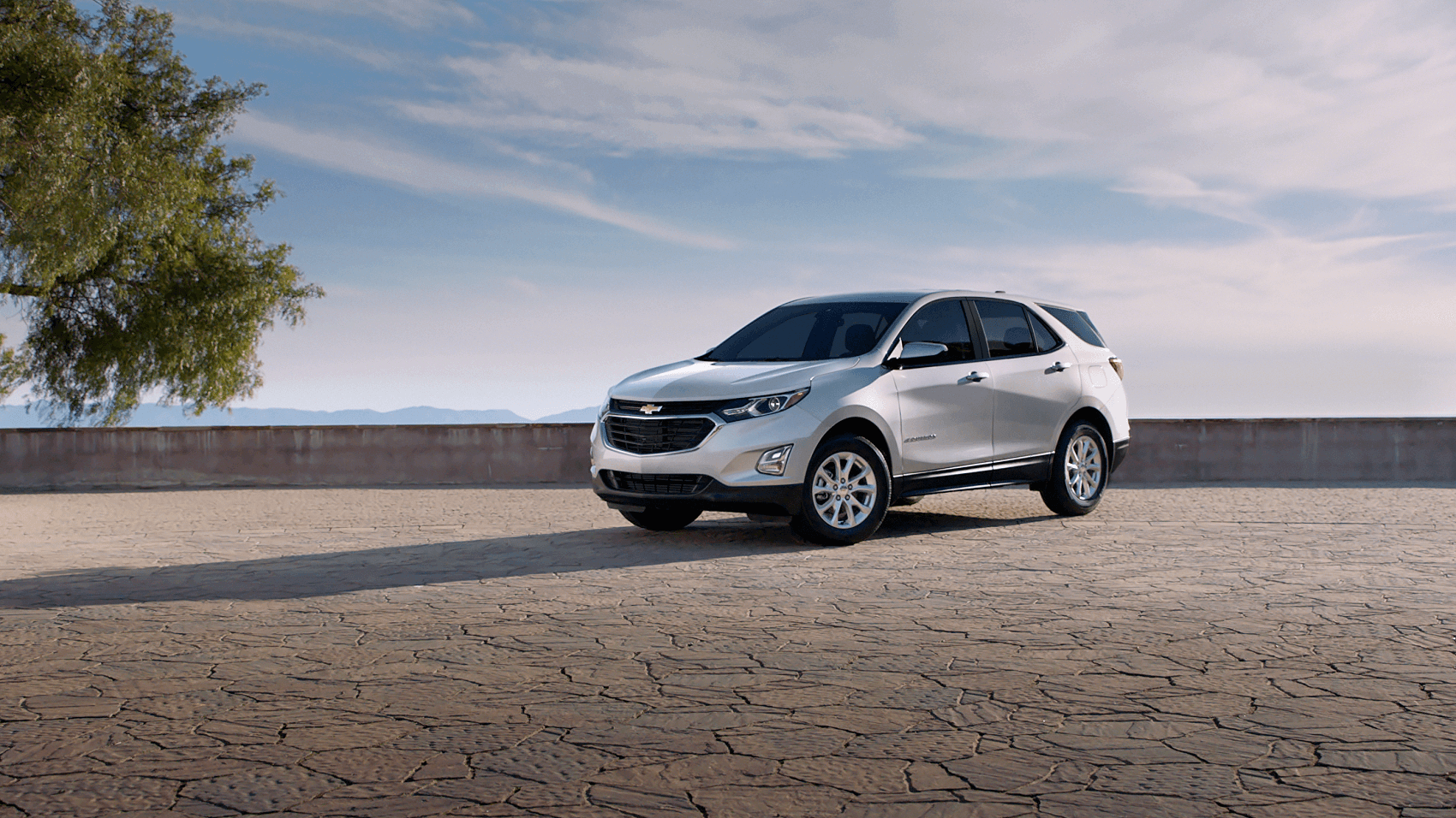 white new Chevy Equinox parked on scenic overlook