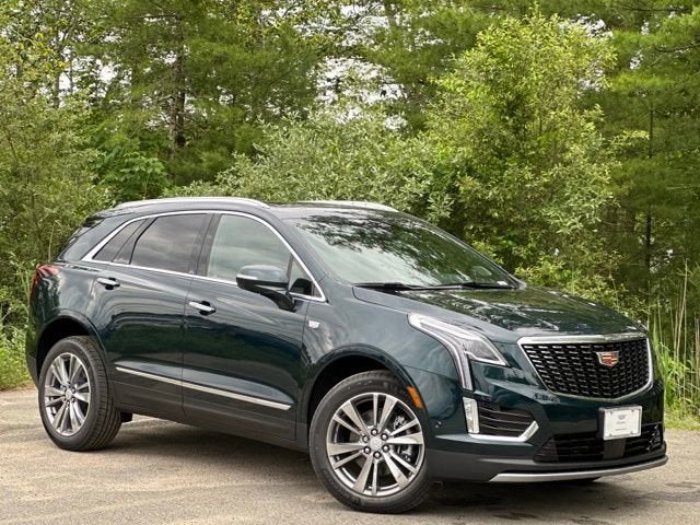 2024 Cadillac XT5 in front of trees