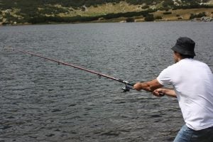 Man in Bucket Hat Fishing