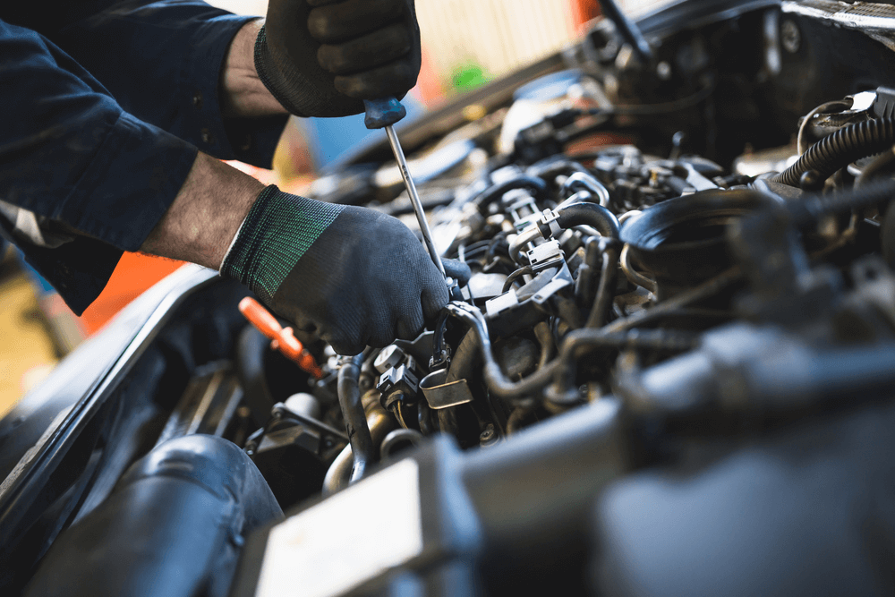 Mechanic Working on Engine