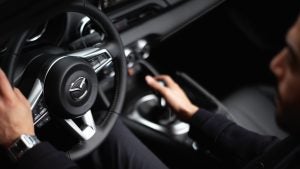view of a guy driving a 2024 mazda mx5