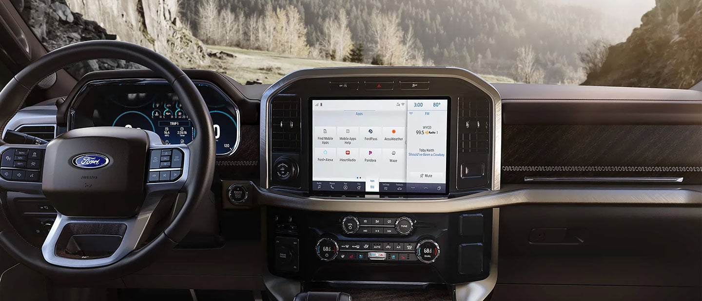 Interior view of a Ford showcasing the infotainment system and dashboard controls.