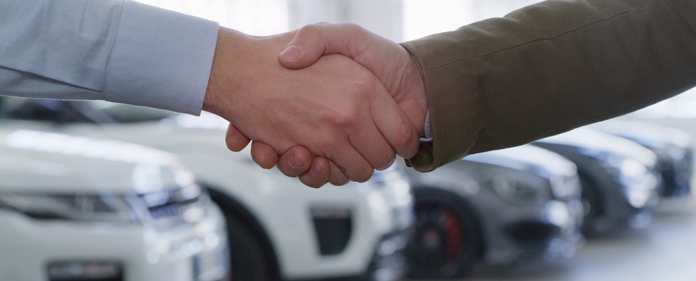 Hands Shaking over Car Deal
