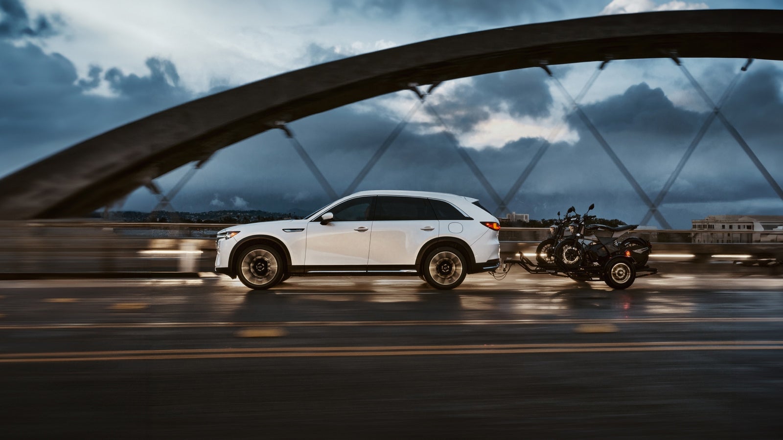 A white Mazda PHEV towing