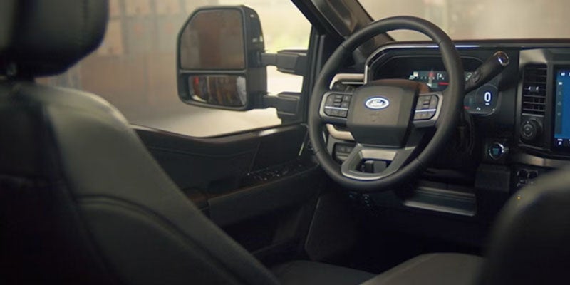 Driver view inside a modern pickup cabin