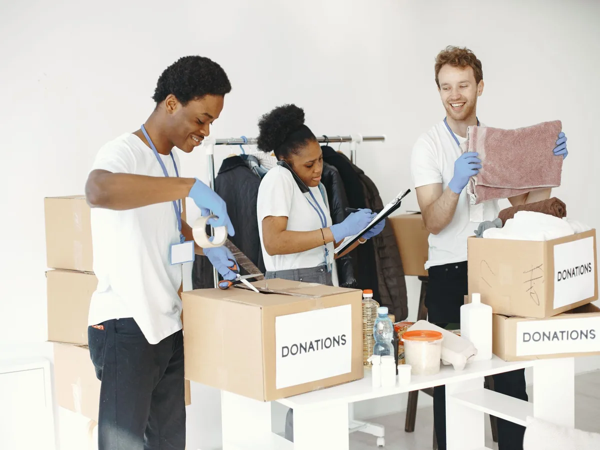 Team volunteers sorting donations at a local community charity event