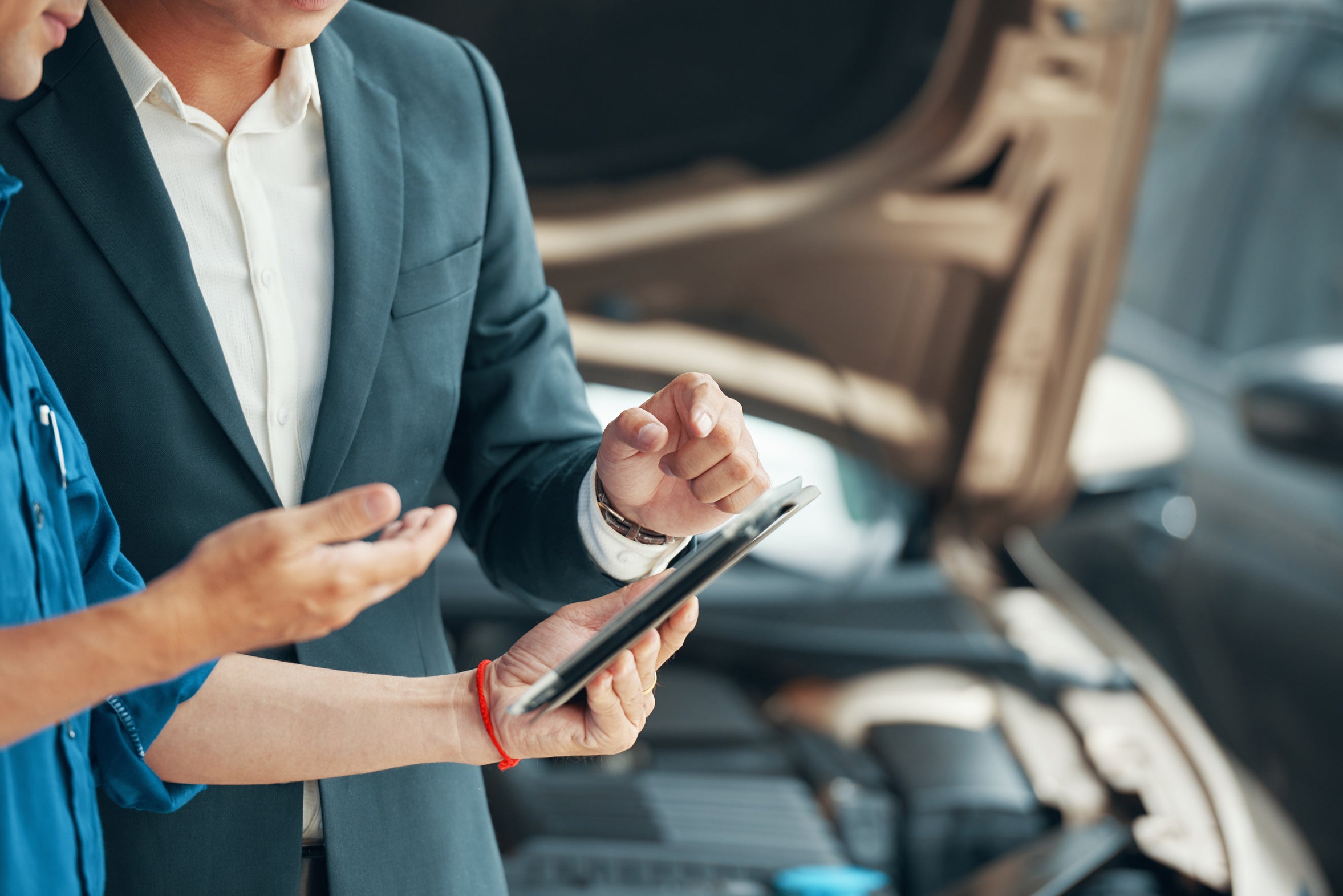 Technician reviewing a vehicle inspection checklist on a tablet