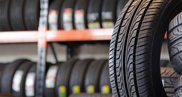 Tire tread with replacement tires displayed behind it