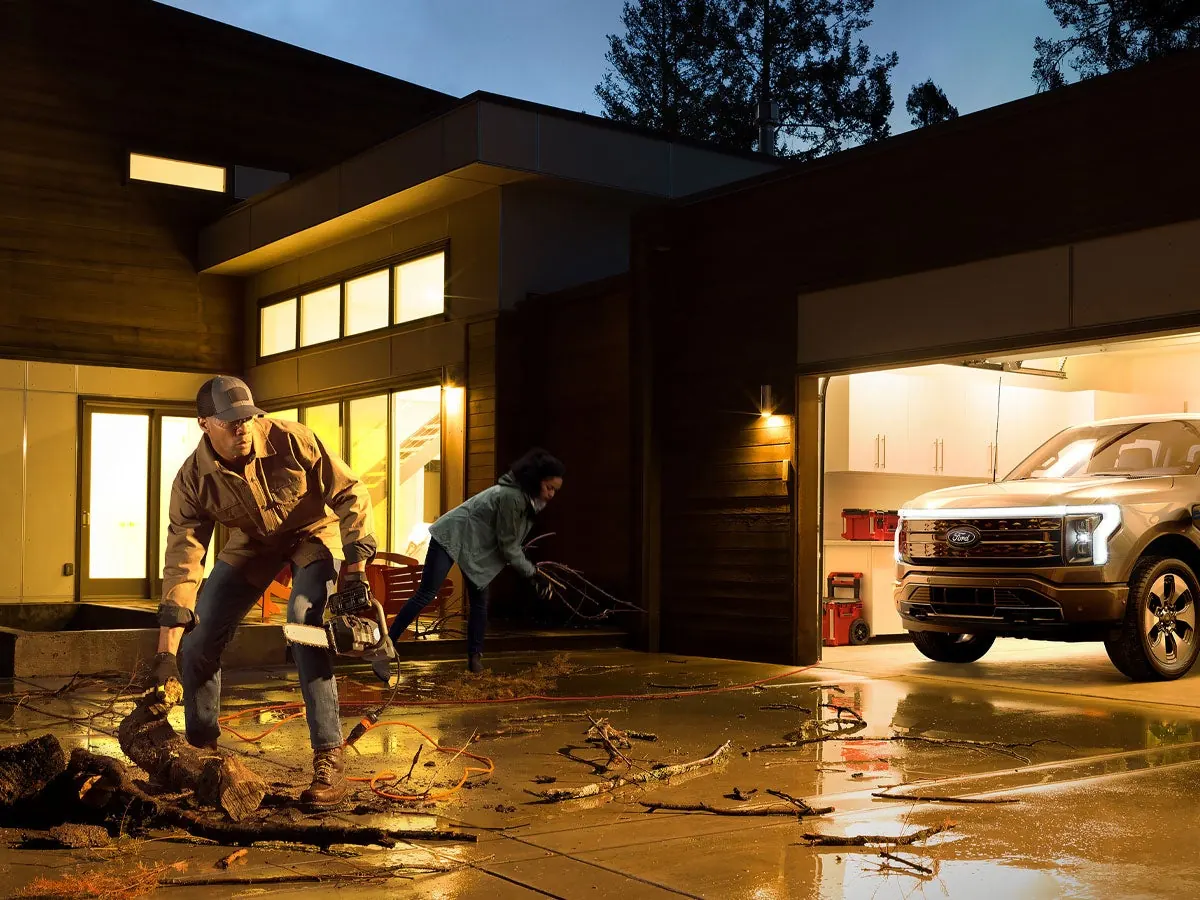 F-150 Lightning in a garage supplying Home Backup Power during an outage