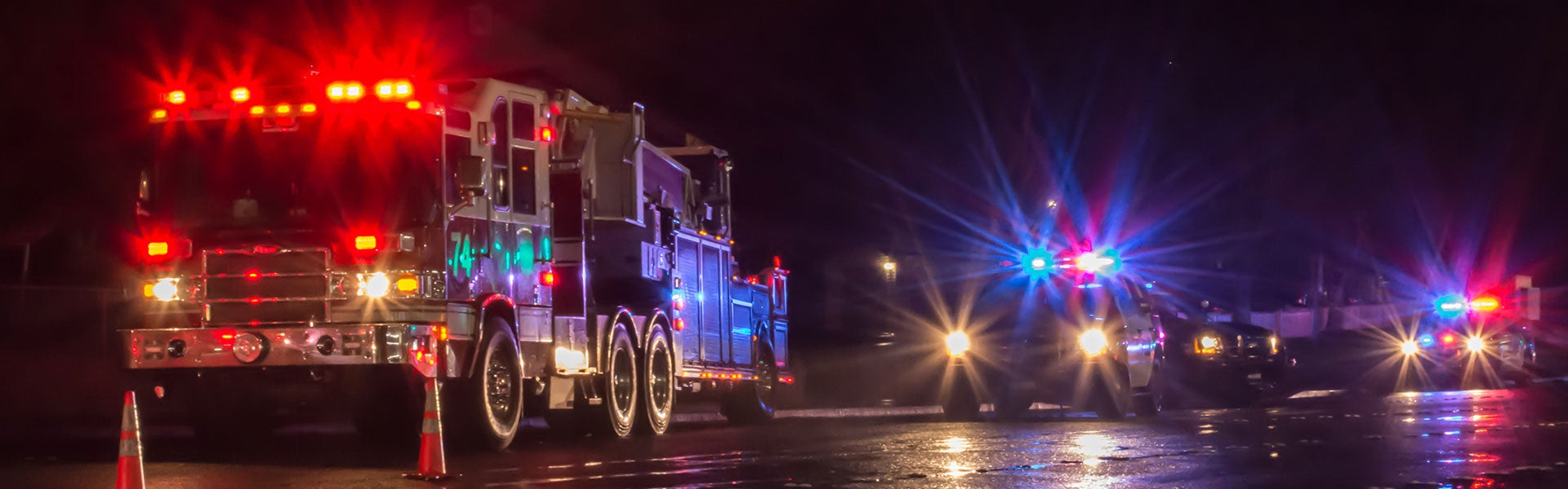 Emergency vehicles illuminated at night