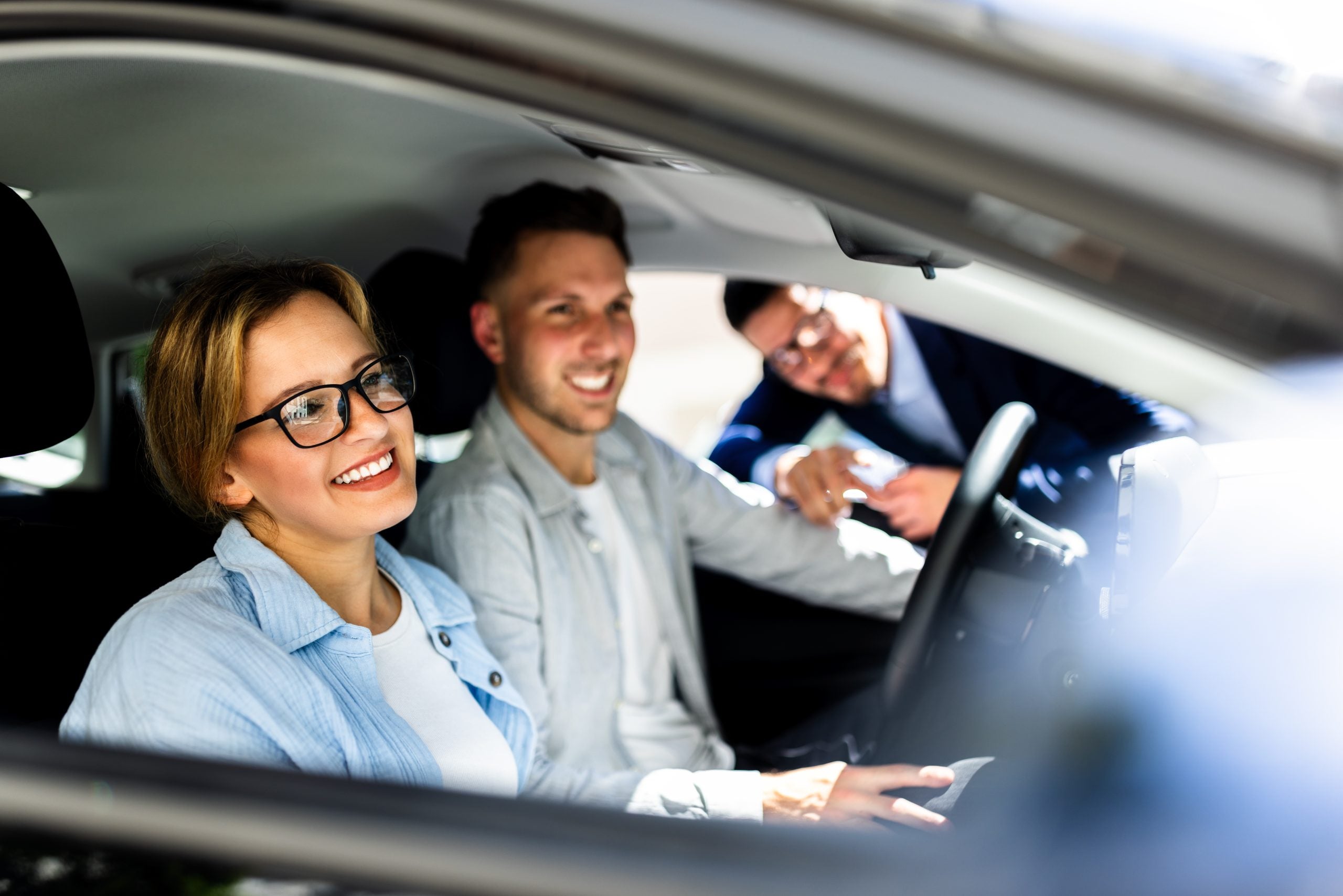 Professional Car Salesman Excitedly Showcases Sleek New Vehicle