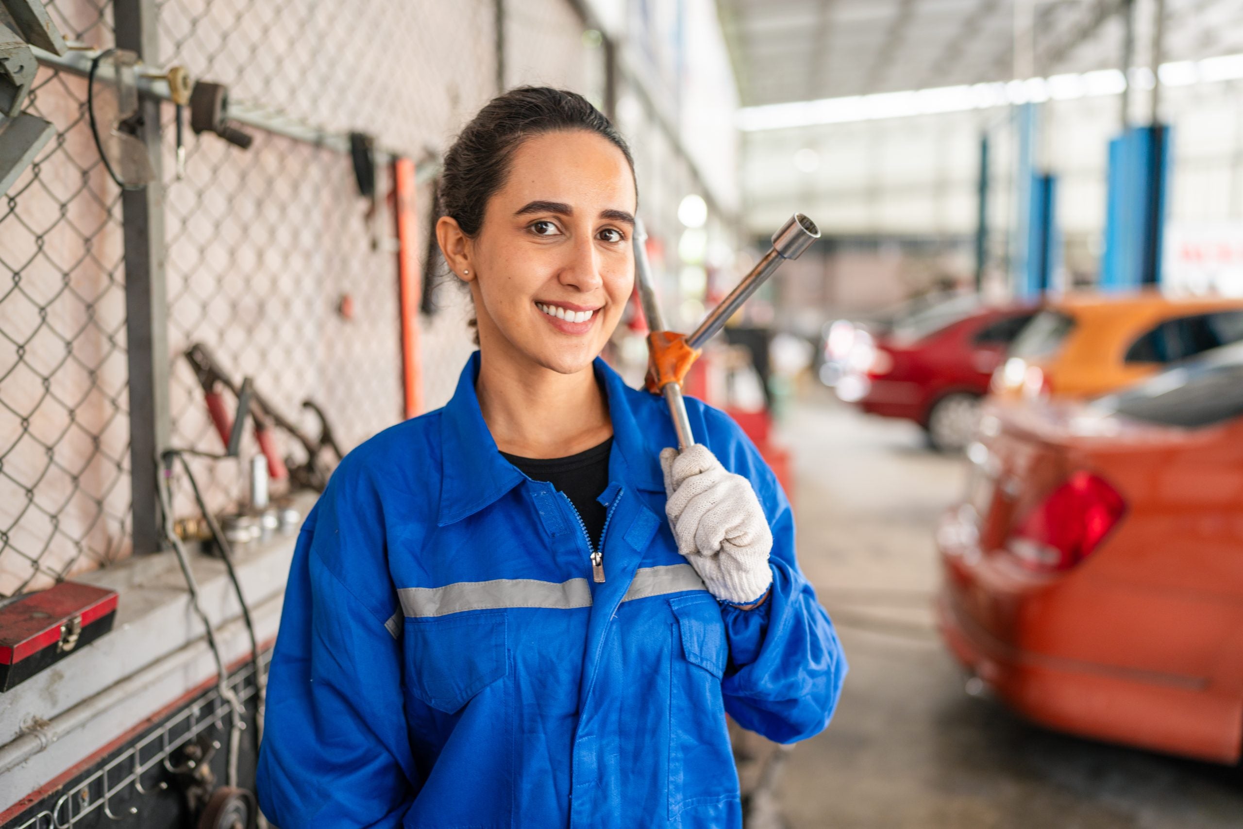 Female Auto mechanic are checking and repair maintenance auto engine.