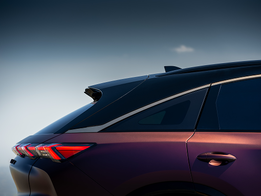 2026 INFINITI QX65 Monograph rear quarter detail showing twisted wheel spokes and premium craftsmanship