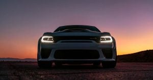 A white 2020 Dodge Charger Widebody at dusk in Sheboygan, WI