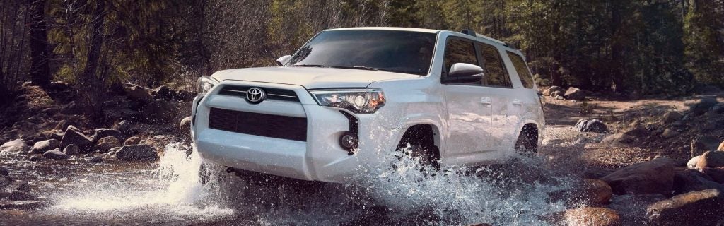 White 4Rubber driving through water