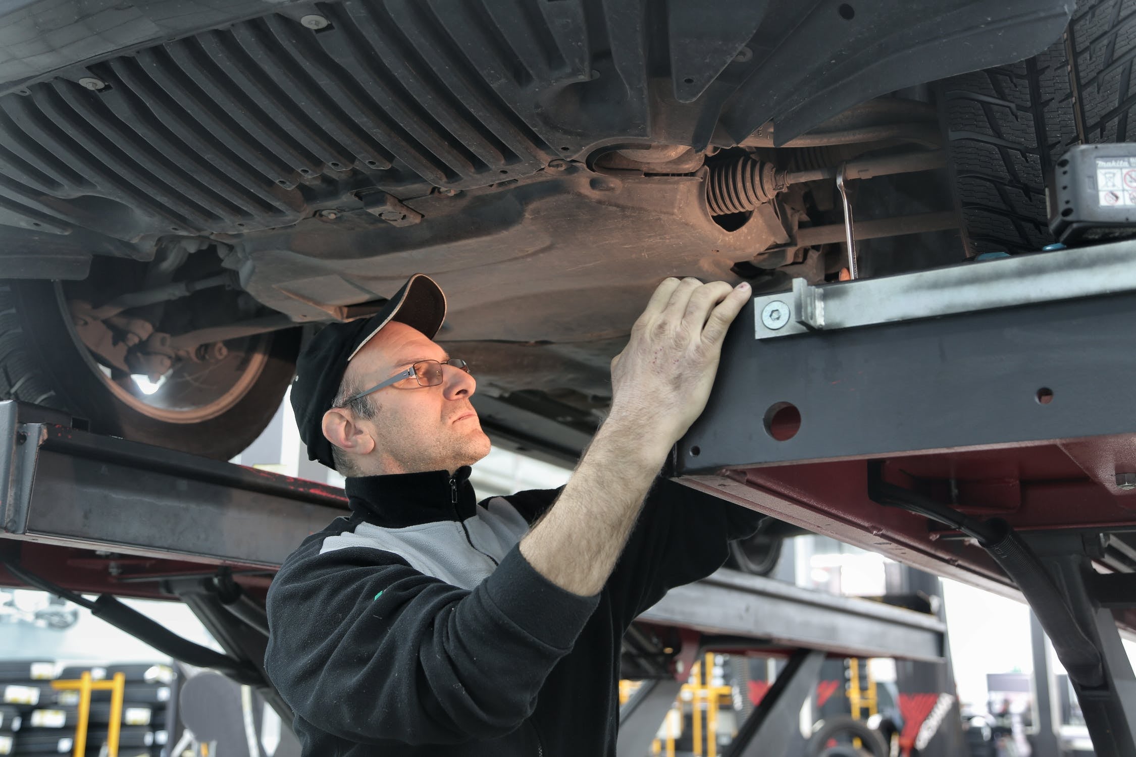 man working on car repair