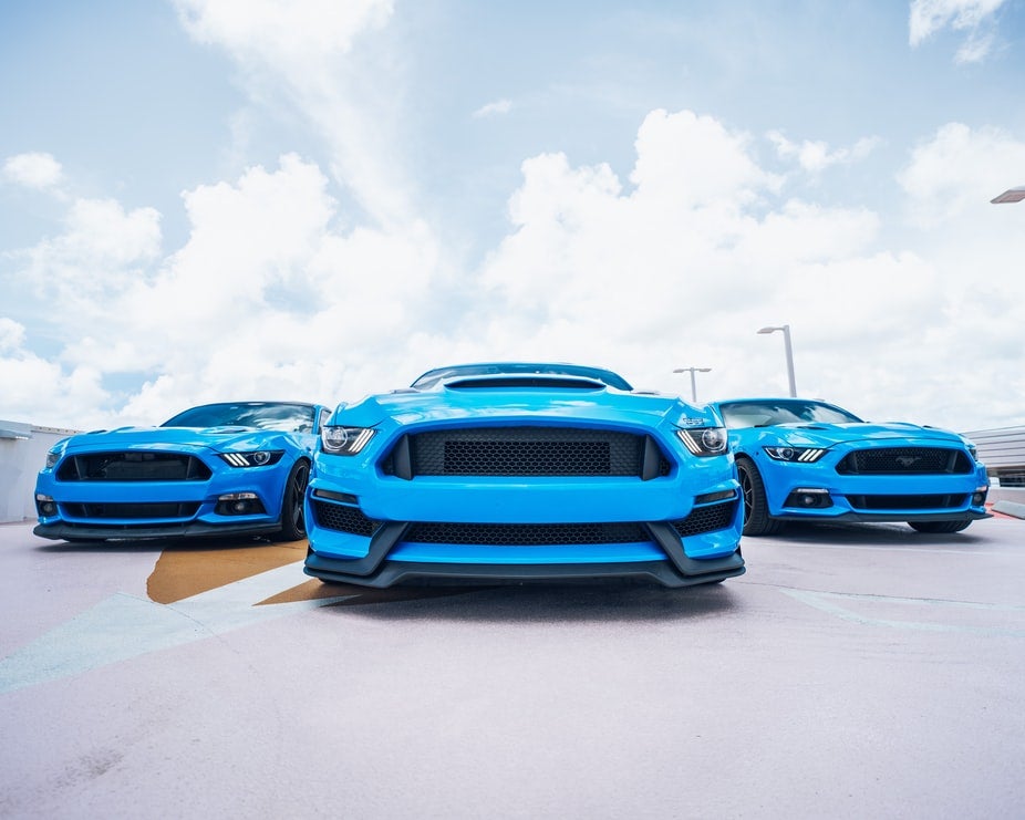 three-blue-new-mustangs-in-a-Joplin-MO-parking-deck