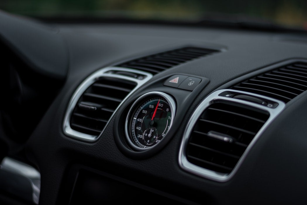 the interior of a nice car, specifically the air conditioning vents.