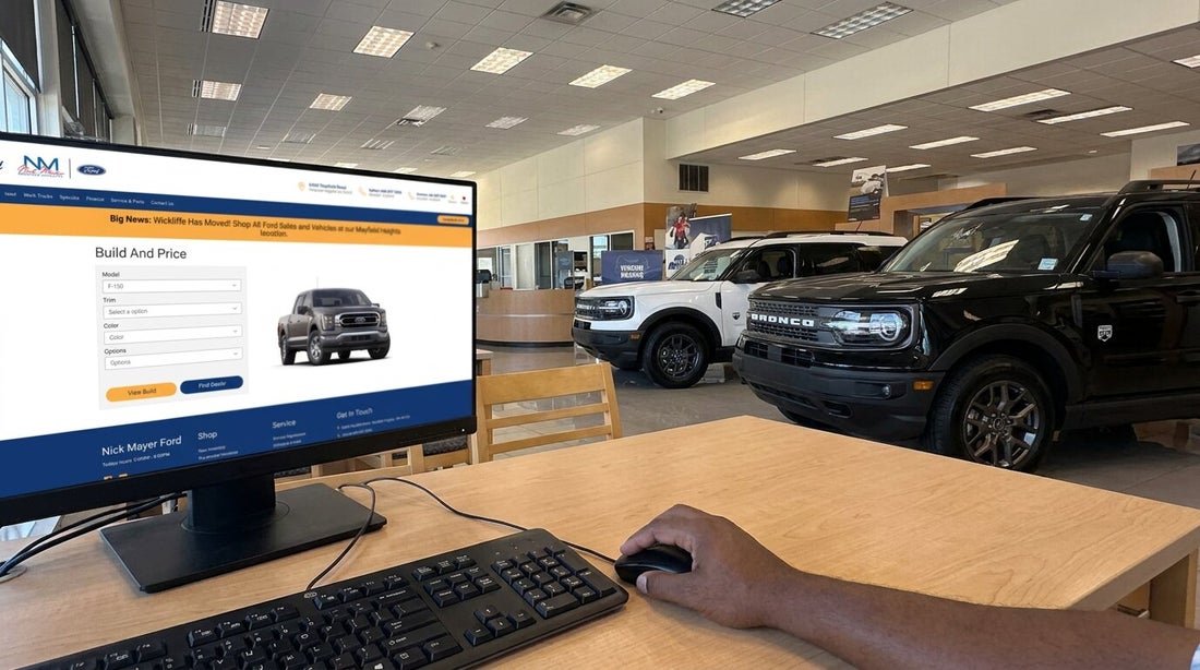 A sales desk at Nick Mayer Ford with the dealership's Build and Price page open on screen and the showroom behind