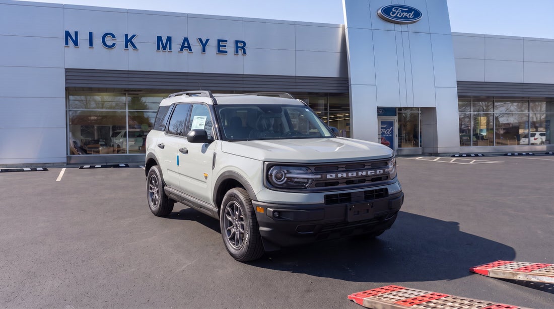 A newly delivered Ford Bronco Sport with its window sticker still in place, parked outside Nick Mayer Ford