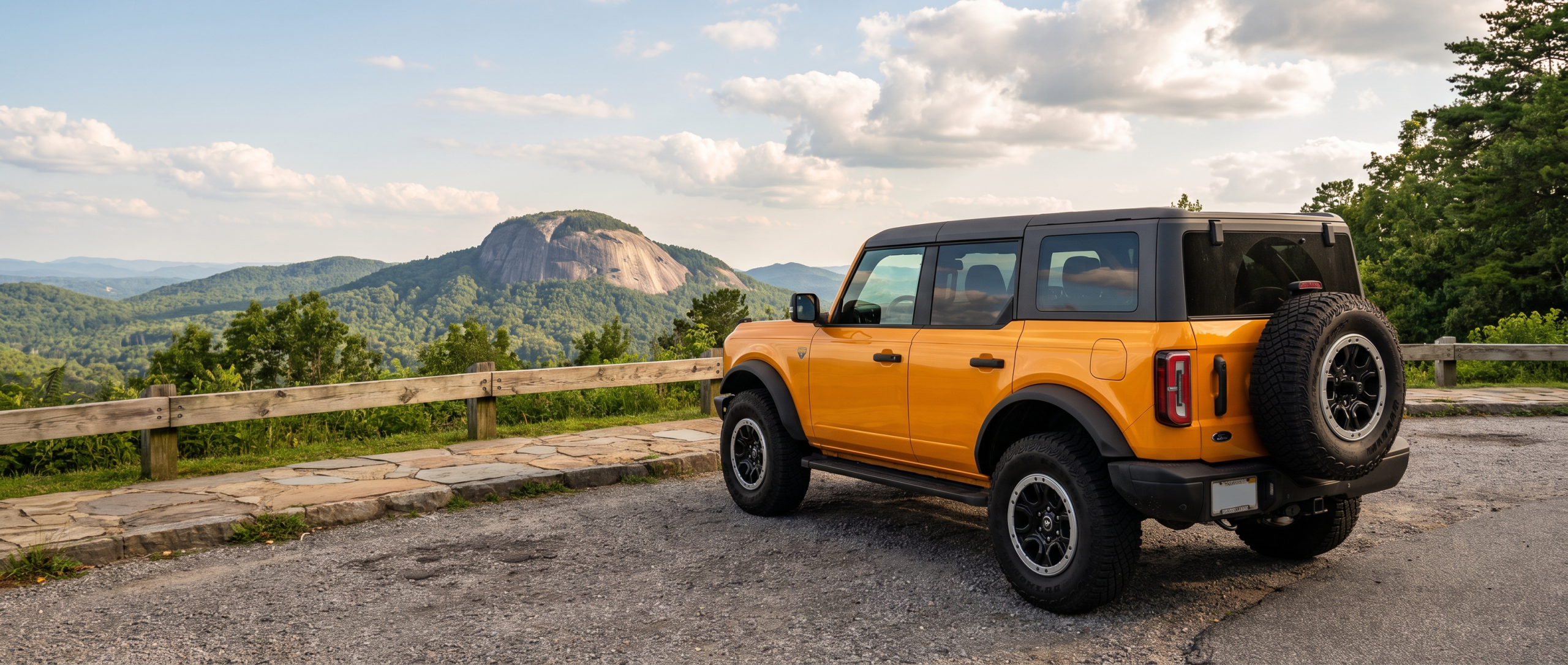2026 Ford Bronco on Cherokee Foothills Scenic Highway 11 with Table Rock Mountain in background, Upstate South Carolina