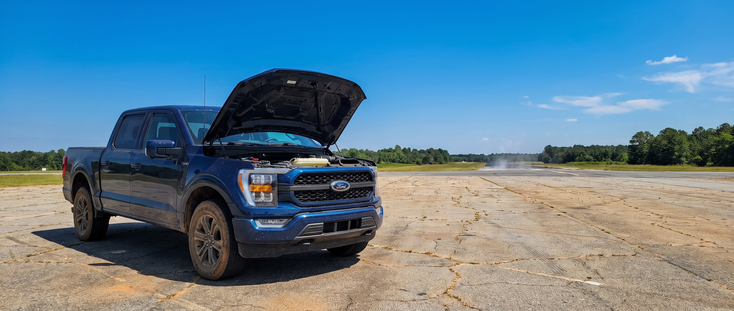 2026 Ford F-150 with hood open during South Carolina summer heat wave battery inspection