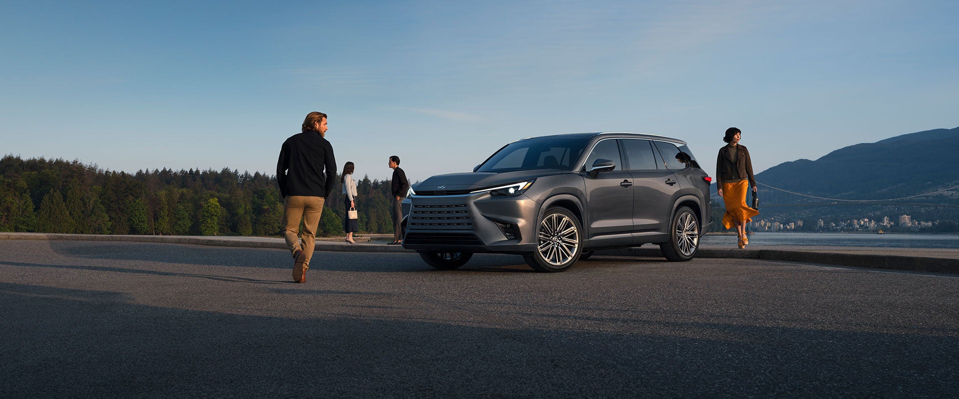Luxury Lexus SUV with mountain backdrop.