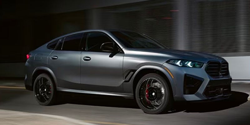 A 2025 BMW X6 driving down the road in Berkeley, CA 