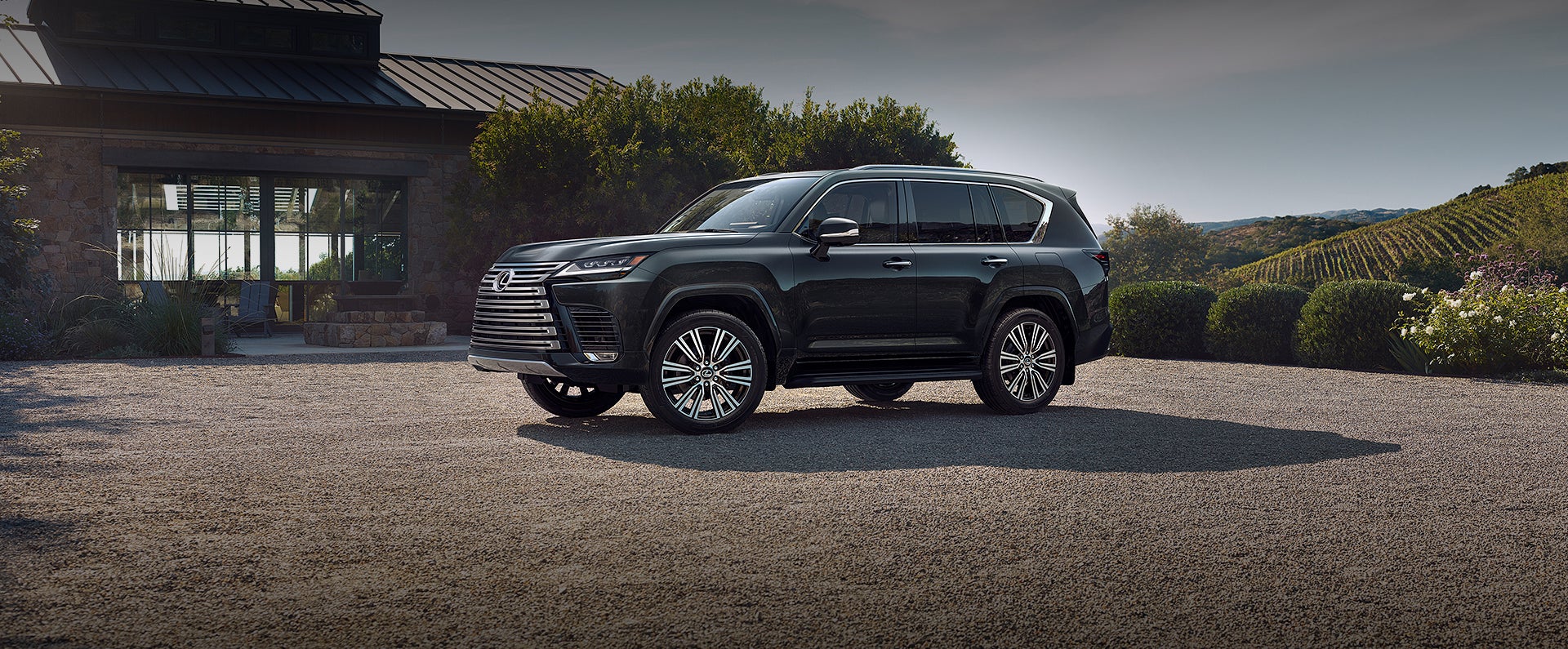 Lexus LX parked in front of a residential house, showcasing its sleek design and robust features.
