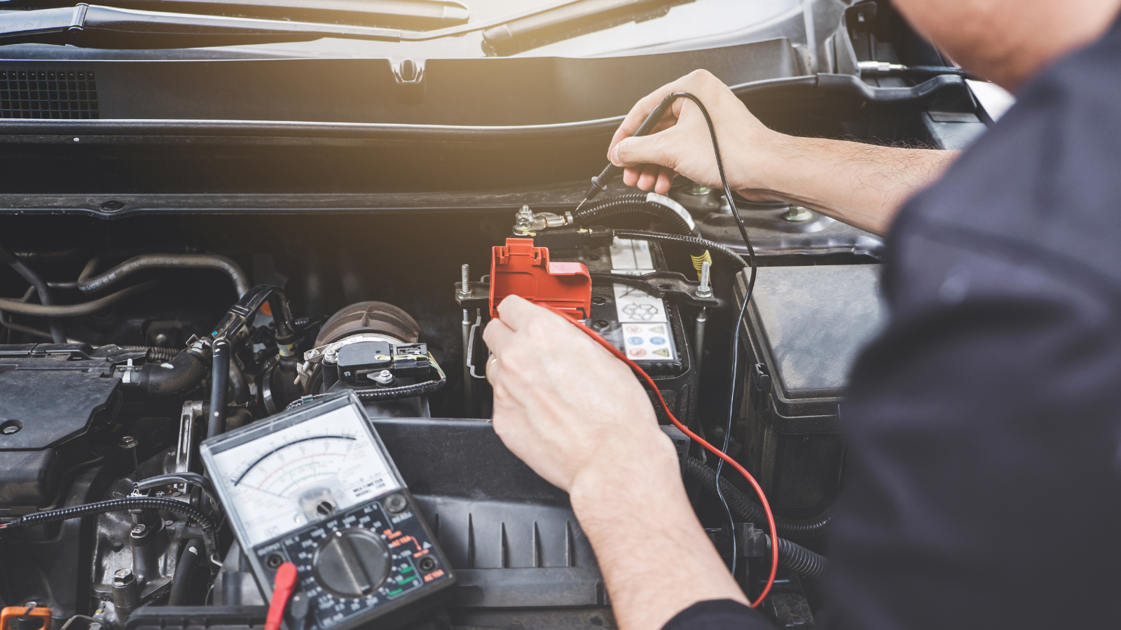 Mechanic working on car engine