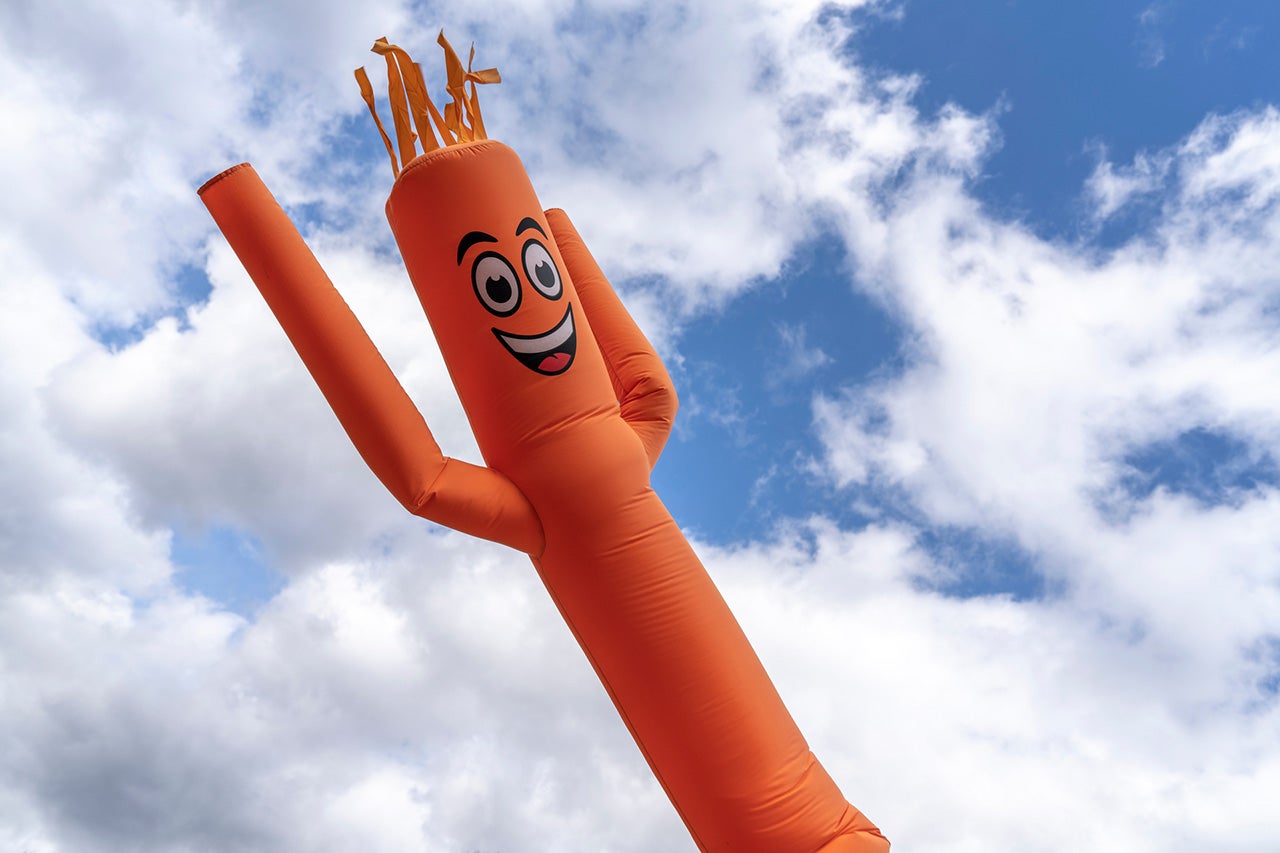 An inflatable man advertising Mazda lease deals