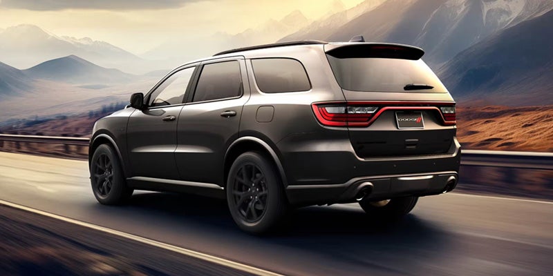 2026 Dodge Durango cruising on highway between mountains