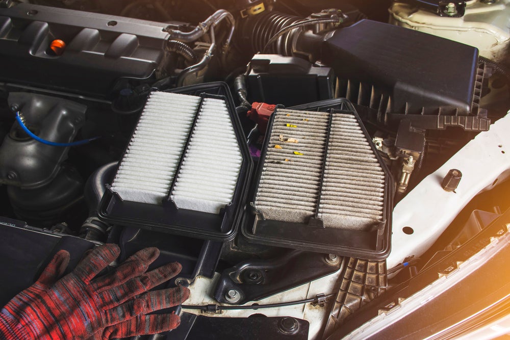 Car,Air,Filter,With,New,And,Old,Placed,On,Car