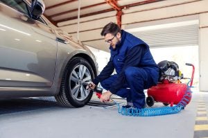 Guy putting air in tire | Greenwich, CT